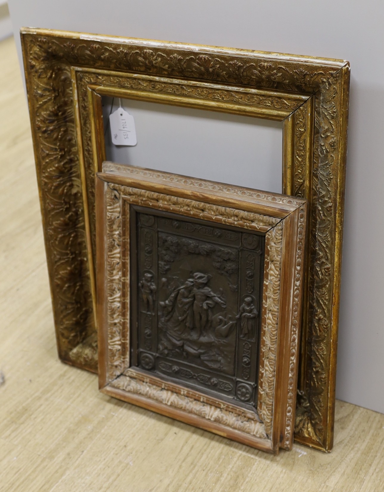 A 19th century giltwood and gesso picture frame, aperture 35 x 27cm, an embossed metal plaque and five assorted engravings